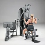 Front view of home gym with dual pivot pec arms and lat pulldown bar