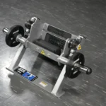 Lower leg strength machine with angled foot platform and dense upper foot pad