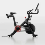 Peloton Connected exercise bike with compact 4 x 2 footprint and manual resistance knob